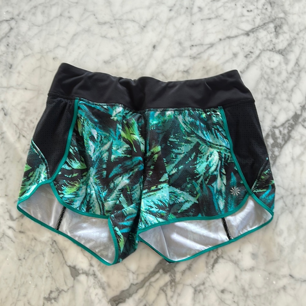 Athlete size small, women’s shorts. Adjustable stretch band inside.